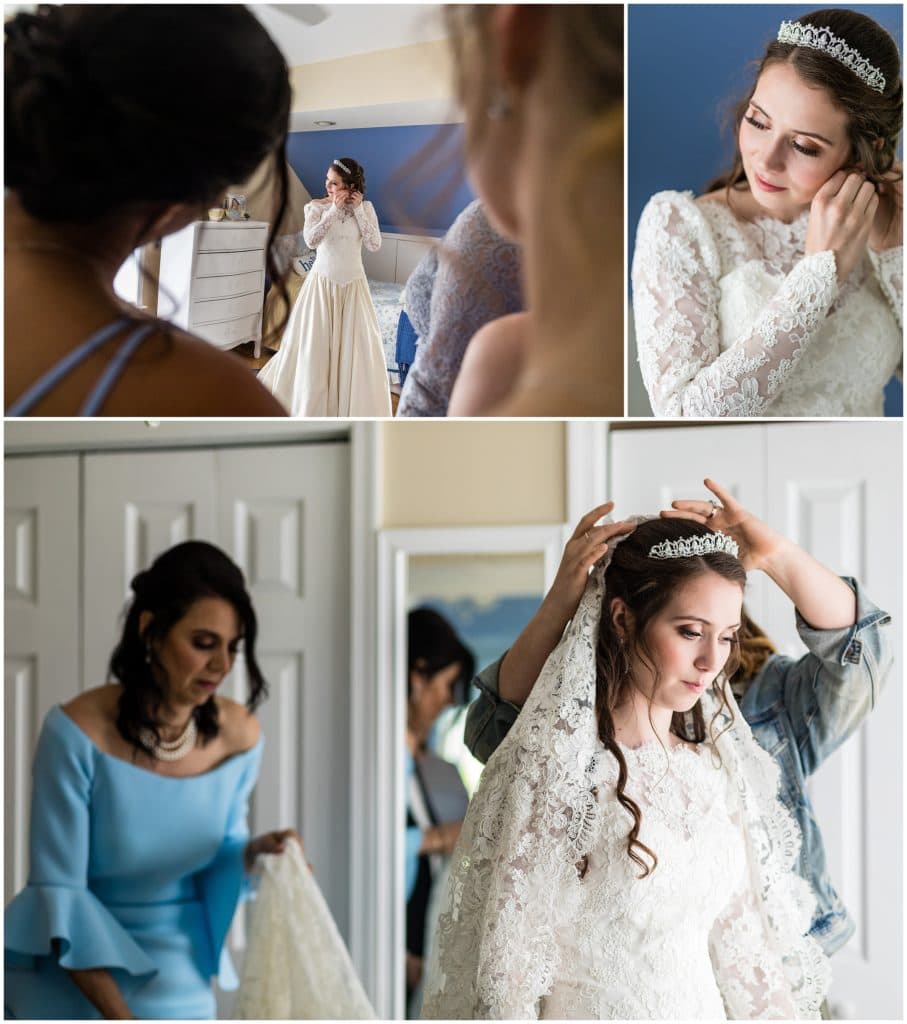 bride putting on her earrings and veil