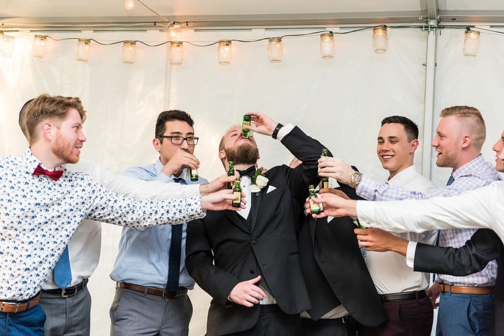 Groom toasting with friends at Anthony Wayne House Wedding | Ashley Gerrity Photography www.ashleygerrityphotography.com