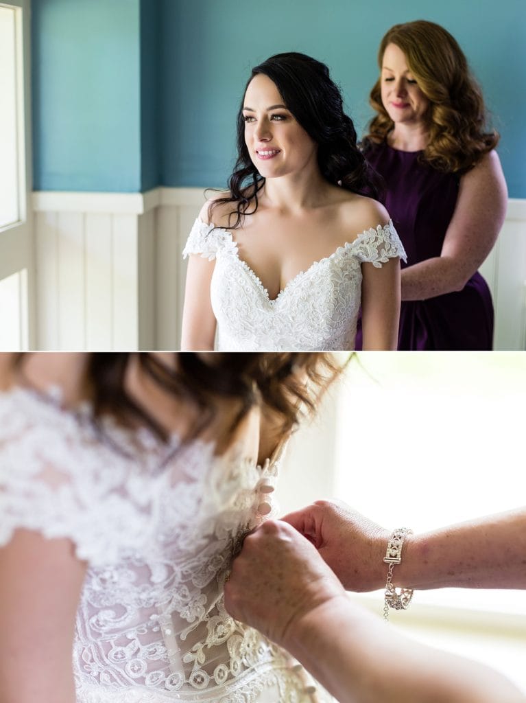 Bride being helped into her wedding dress by mother of the bride | Ashley Gerrity Photography www.ashleygerrityphotography.com