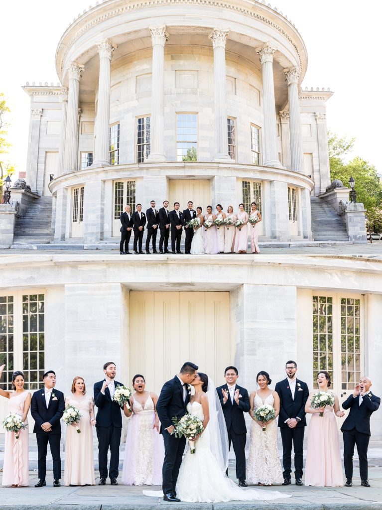 Wedding party gathered outside the Merchant Exchange Building in Philadelphia | Ashley Gerrity Photography www.ashleygerrityphotography.com