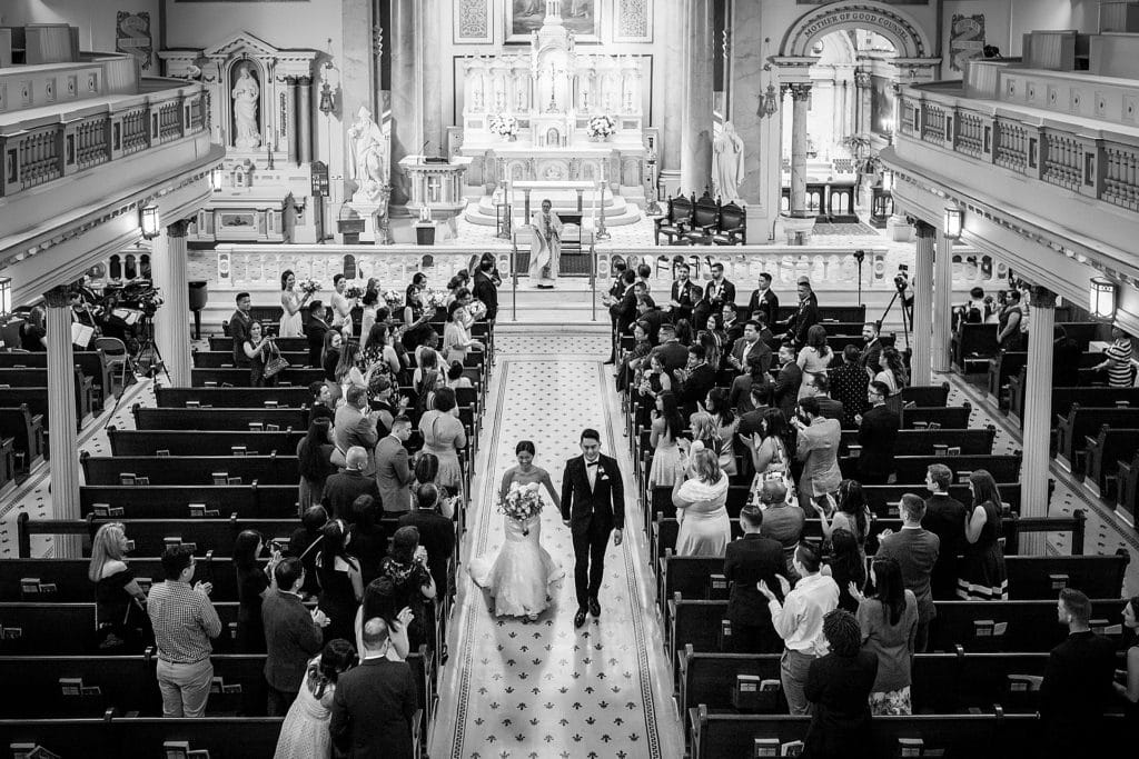 Bride and groom walking back up the aisle as newlyweds at St Augustine Church | Ashley Gerrity Photography www.ashleygerrityphotography.com
