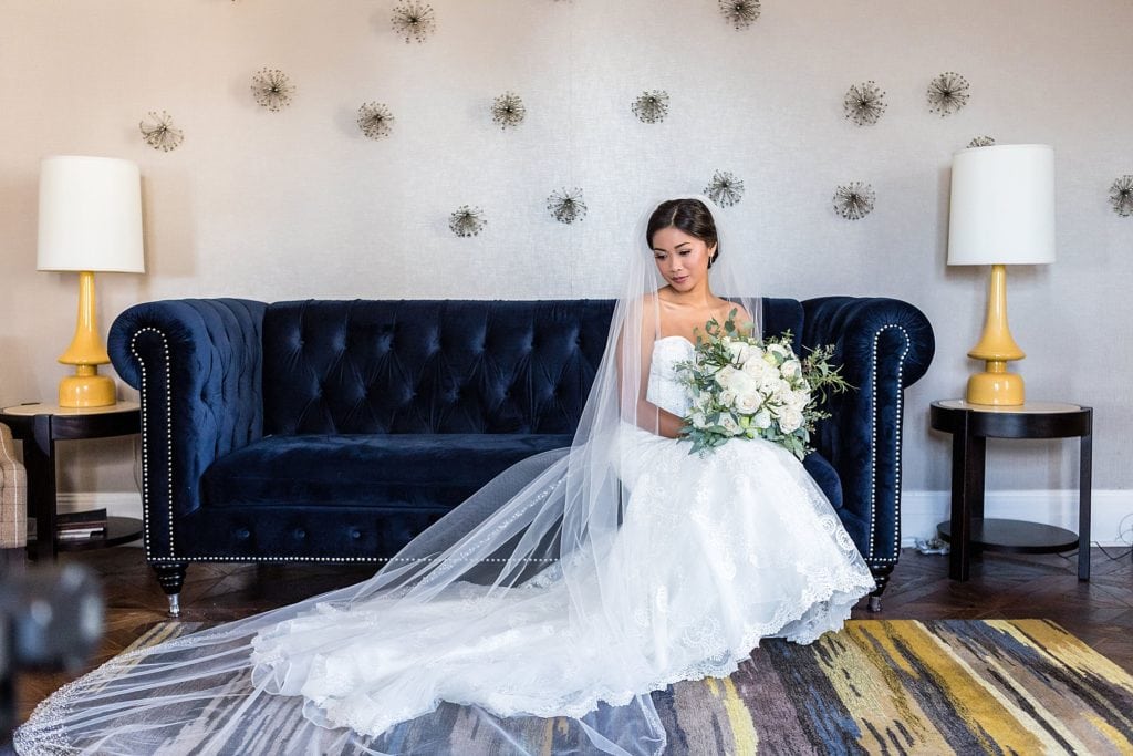 Portraits of the bride with Beautiful Blooms bouquet on sofa at Bellevue Philadelphia Hotel | Ashley Gerrity Photography www.ashleygerrityphotography.com