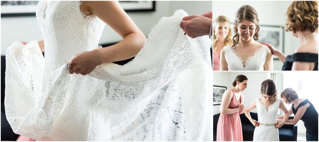Detail of bride holding her wedding dress and getting ready with help from her mom and bridesmaid