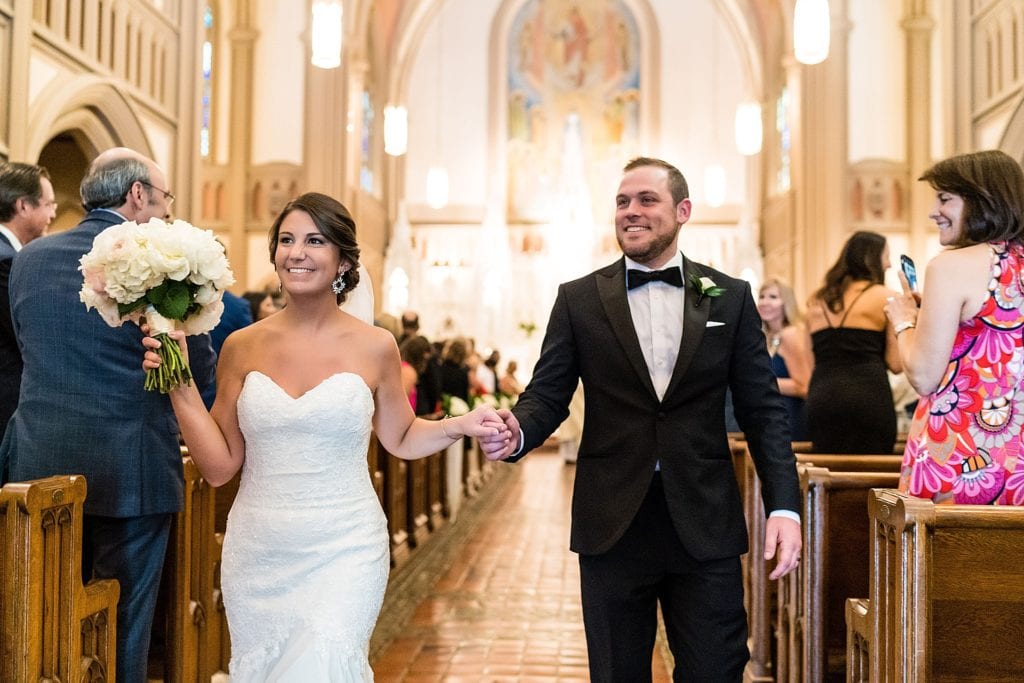 Bride and groom leaving the church as newlyweds | Ashley Gerrity Photography www.ashleygerrityphotography.com