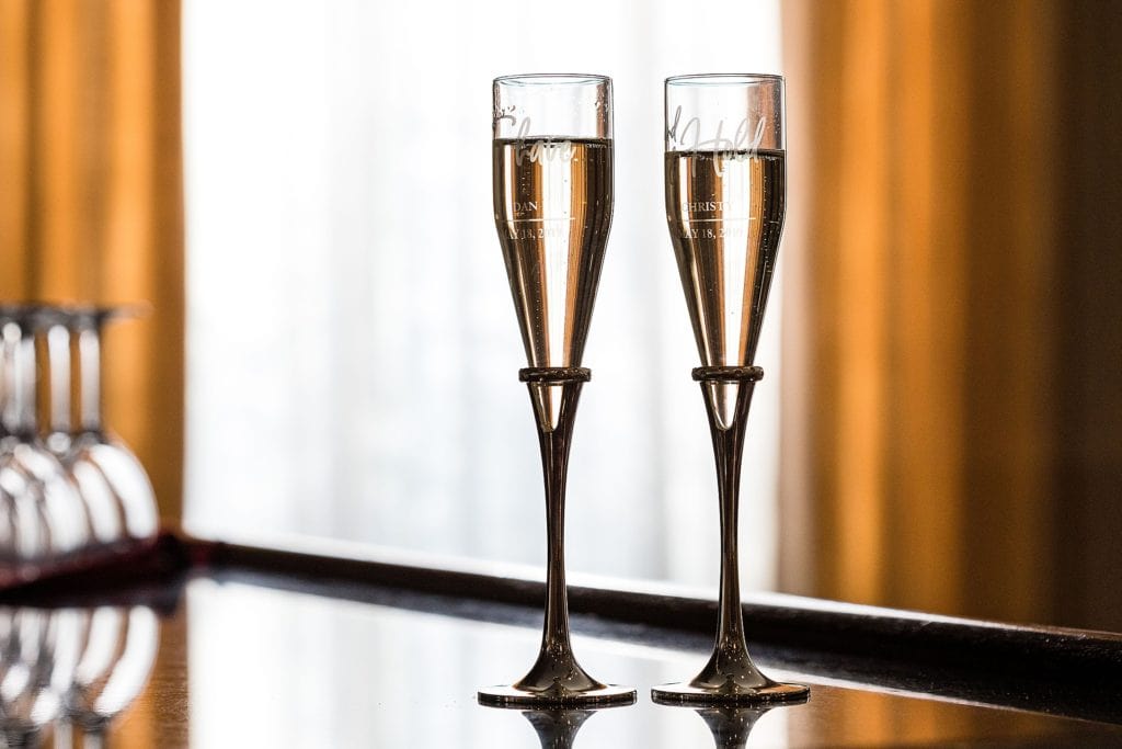 His and hers champagne glasses for the bride and groom | Ashley Gerrity Photography www.ashleygerrityphotography.com