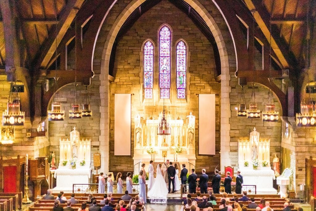 Full wedding party at the altar in St Agnes Parish Church | Ashley Gerrity Photography www.ashleygerrityphotography.com