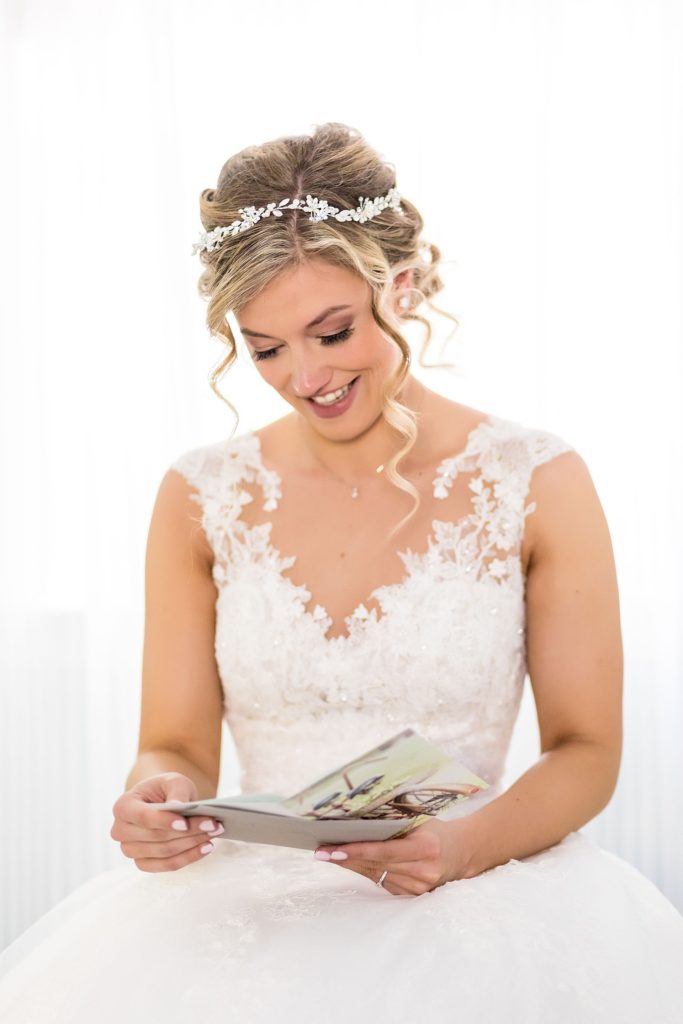 Bride reading a message from the groom before the wedding ceremony | Ashley Gerrity Photography www.ashleygerrityphotography.com