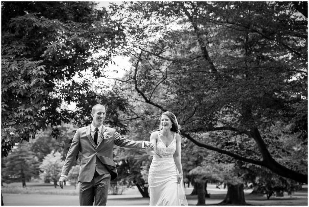 black and white bride and groom laughing on the way to their wedding
