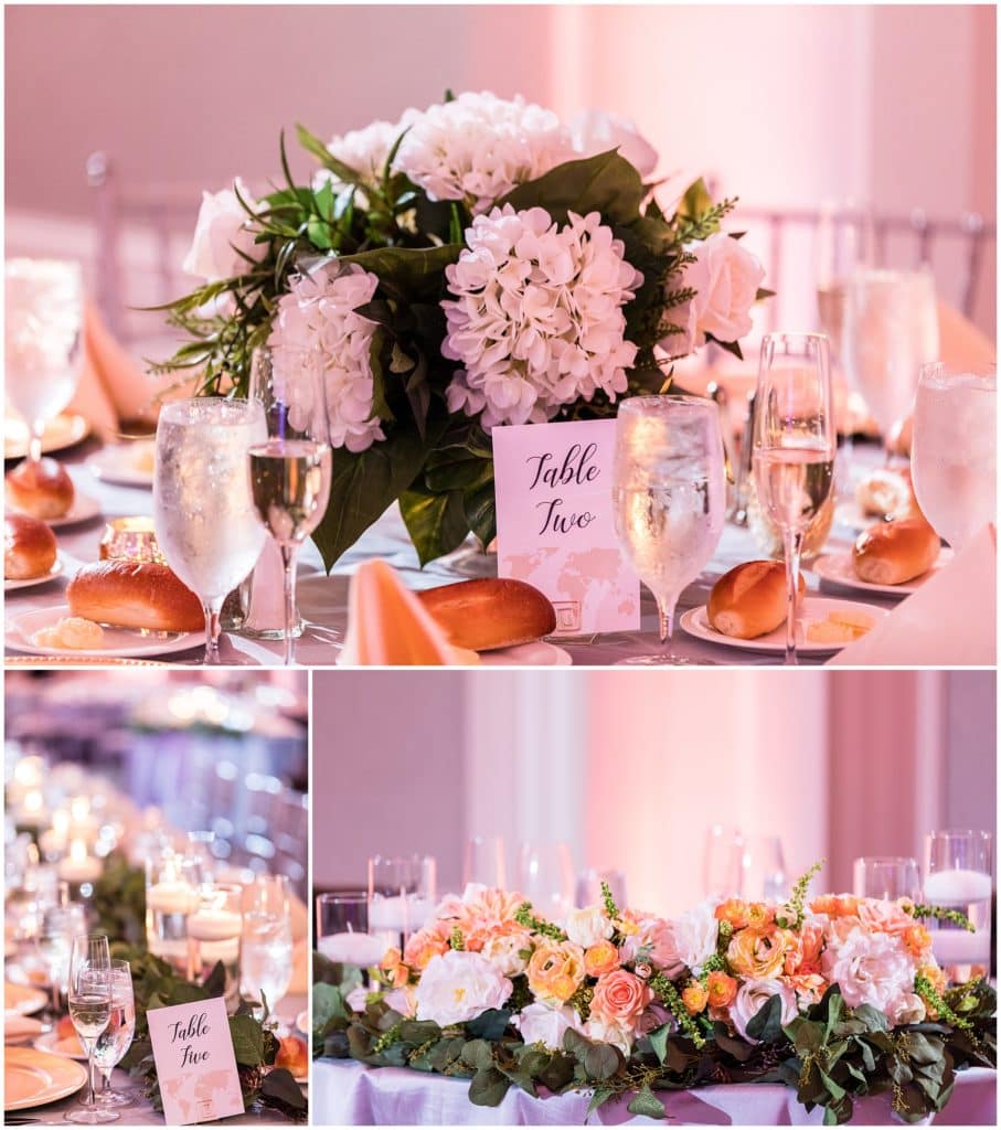 wedding reception table details with floral centerpieces and table signs