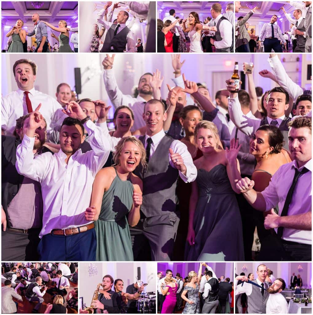 bridal party and guests enjoying themselves on the dance floor and with the band during wedding reception