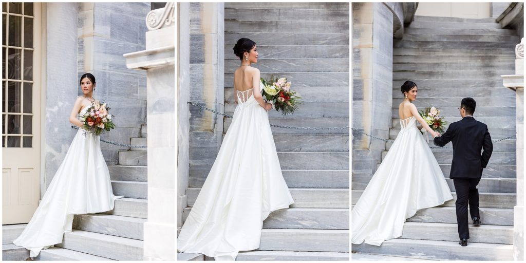 Bridal portrait on marble stairs, groom taking her hand.