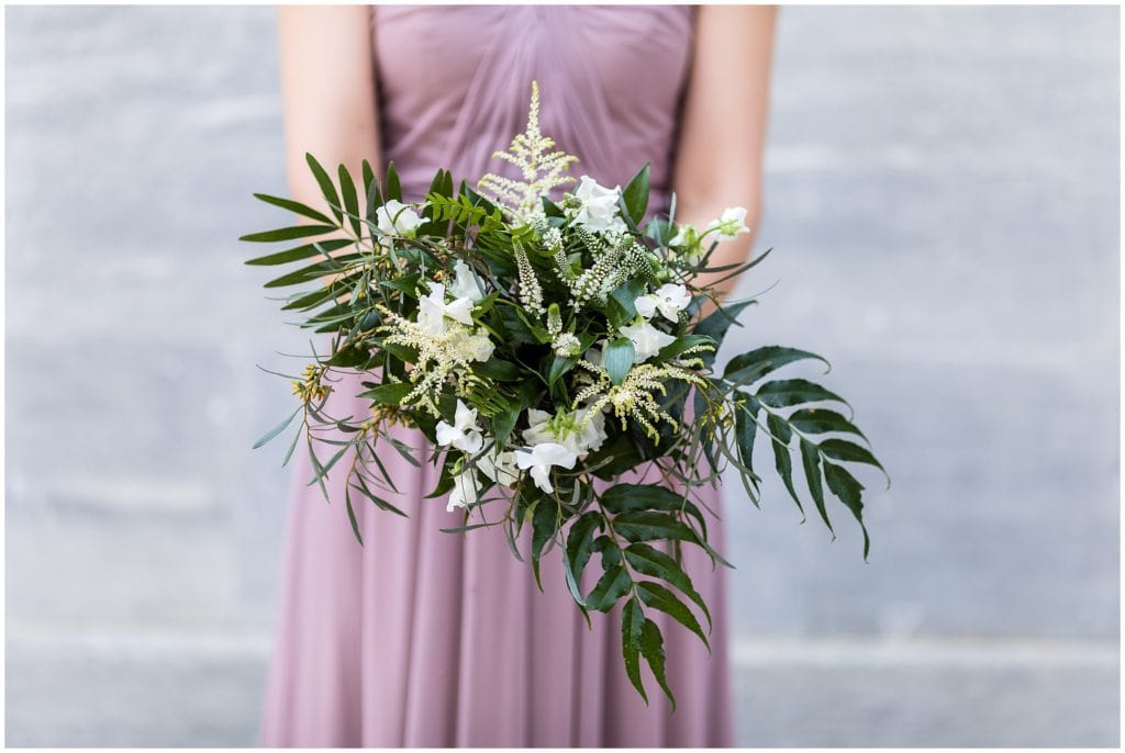 loose bridesmaid bouquet of greens and white flowers, bridesmaid wearing purple dress