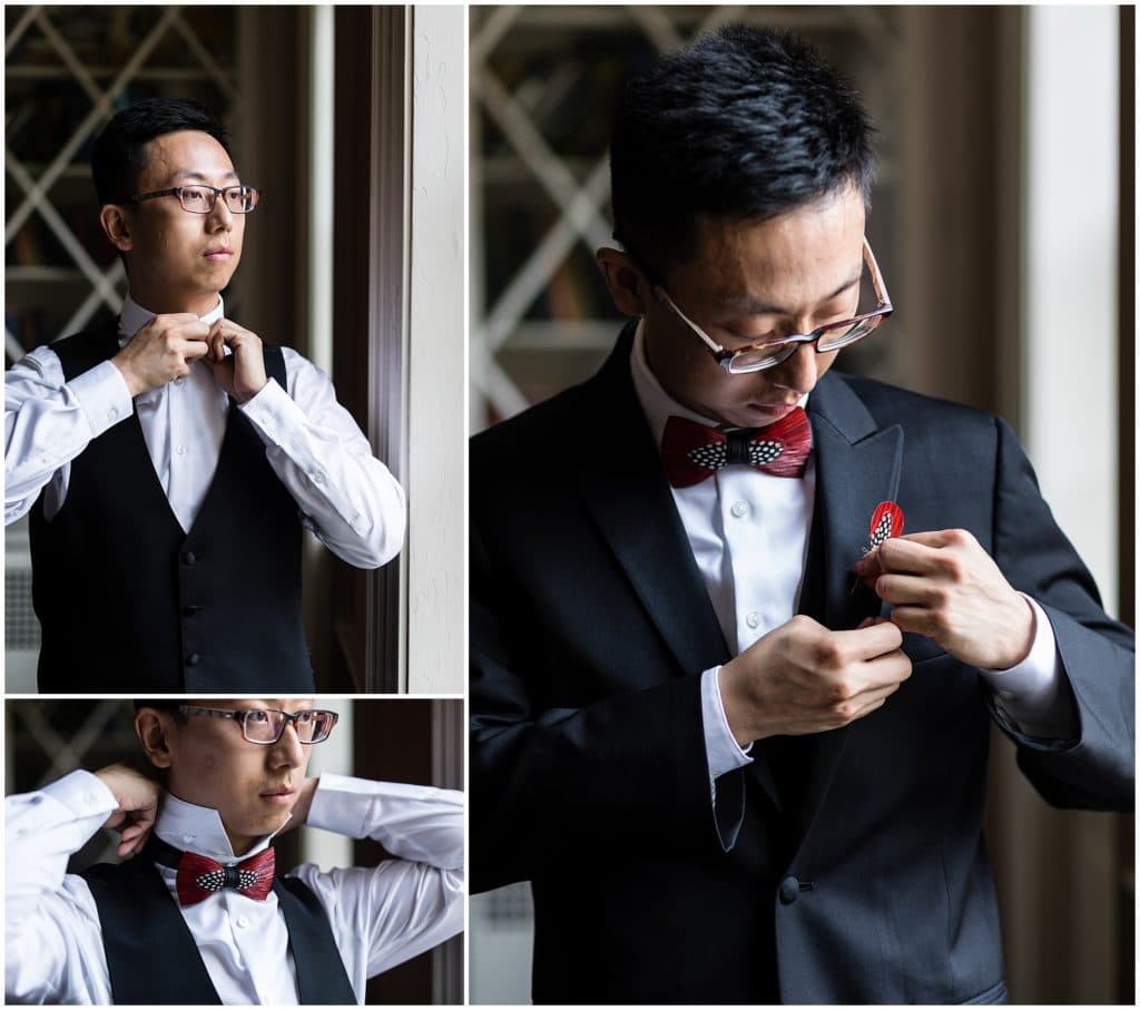 Groom putting on his unique feather bow tie and boutonniere as he gets dressed