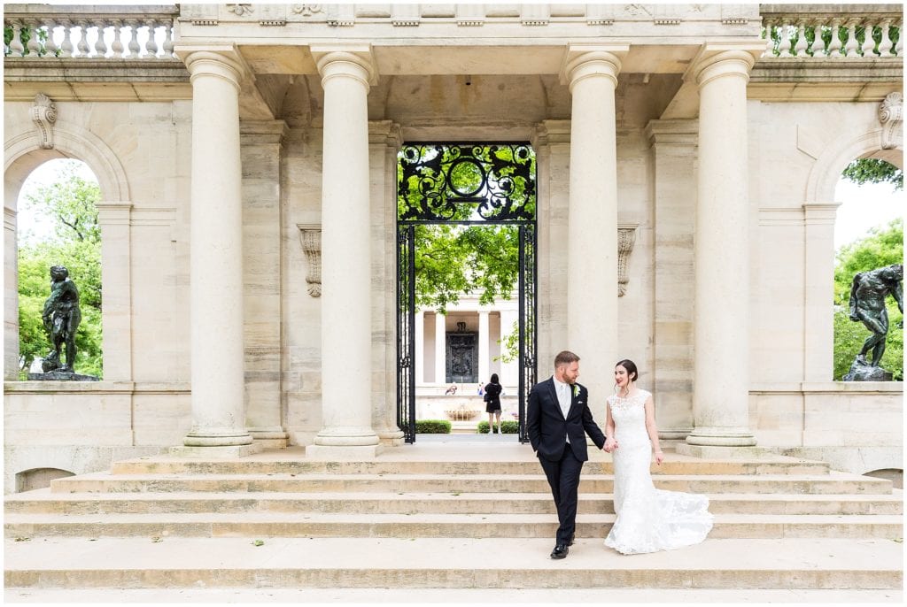 Groom leading bride down the stairs of the Rodin Museum - philadelphia wedding permit process