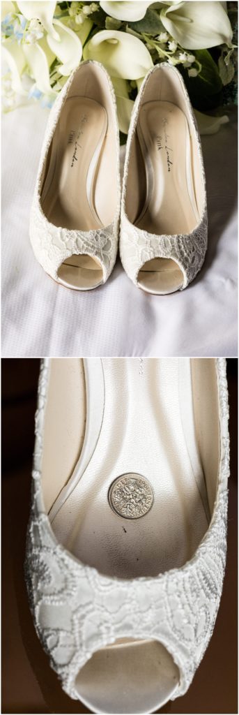 Details of lace peeptoe bridal shoes with a sixpence inside