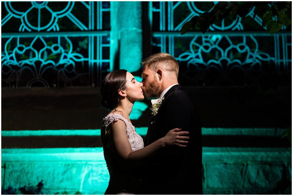 Dramatic nighttime portrait of bride and groom in the courtyard of the College of Physicians