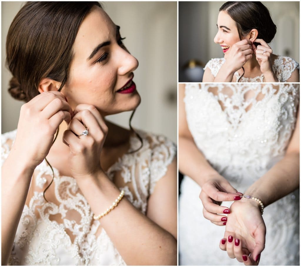 Bride putting on her bracelet and earrings