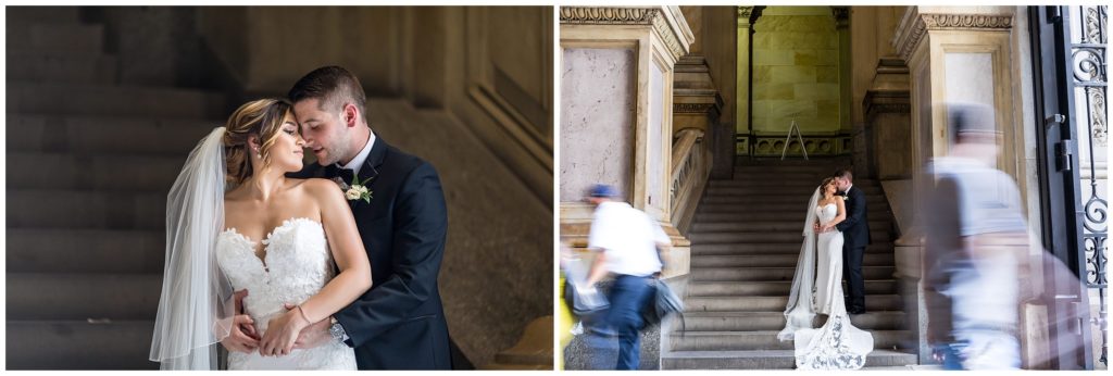 Intimate outdoor portrait of bride and groom on stairs at City Hall with people passing through