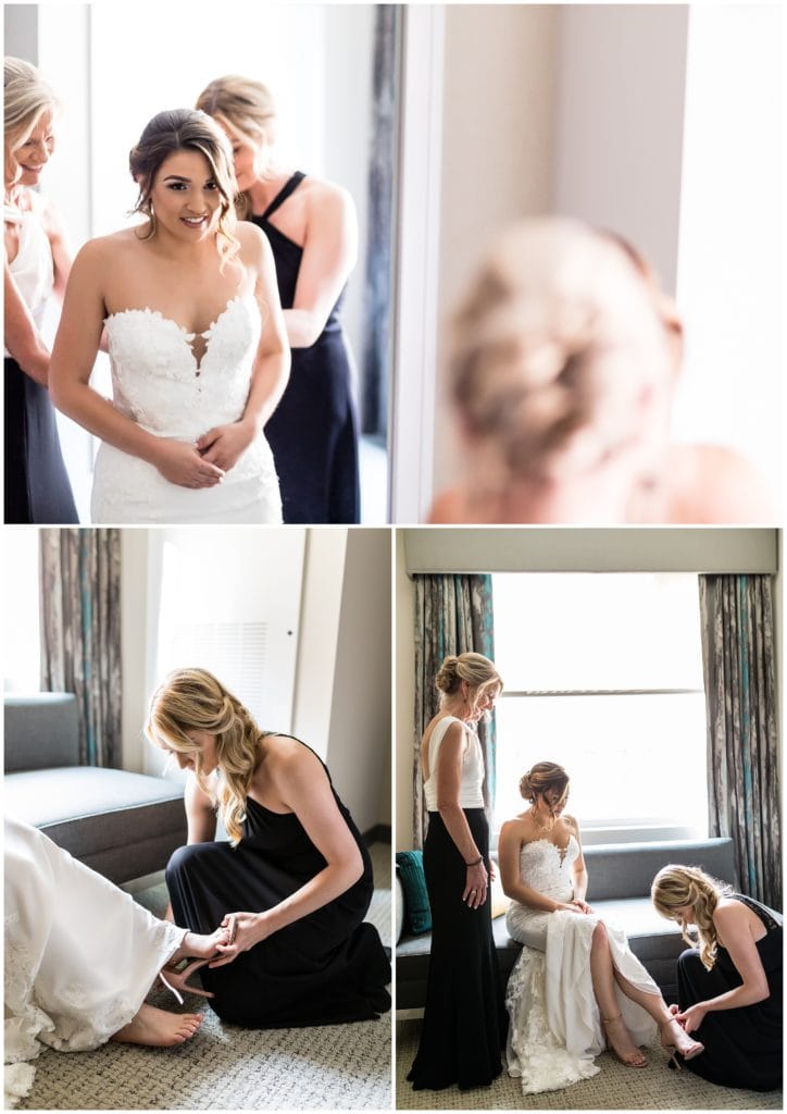 Bride getting dressed at the Cambria Hotel for her wedding at The Lucy by Cescaphe