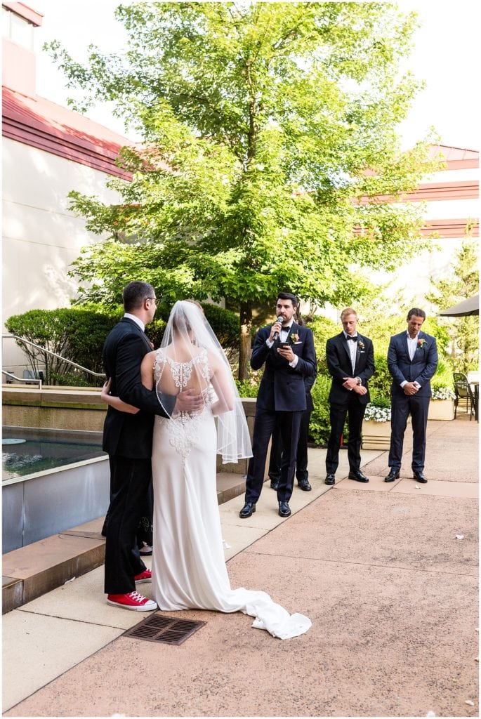 Best man reading a select poem