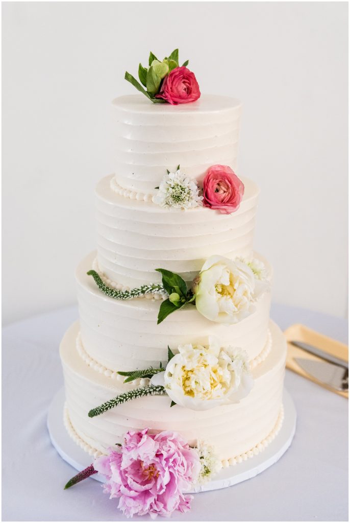detail of wedding cake decorated with flowers