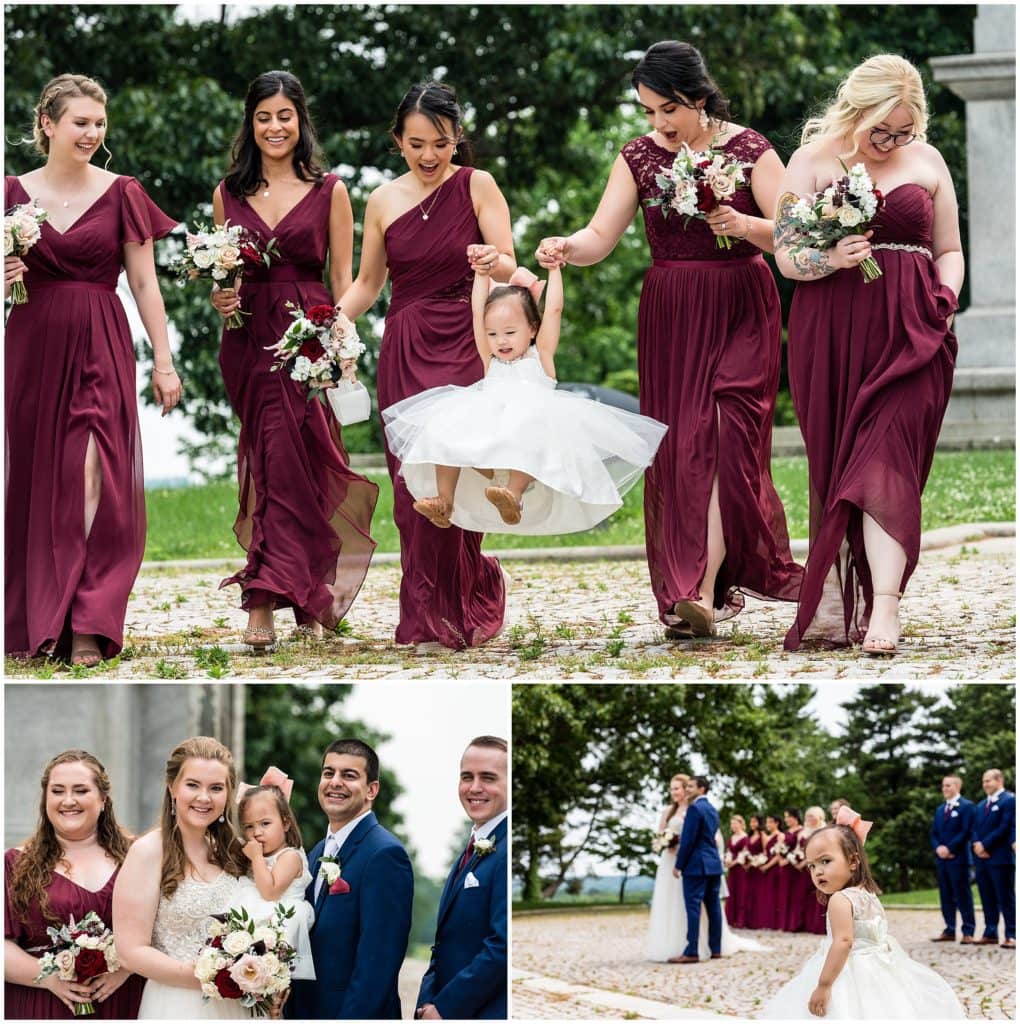 fun bridal party with baby flower girl stealing the spotlight