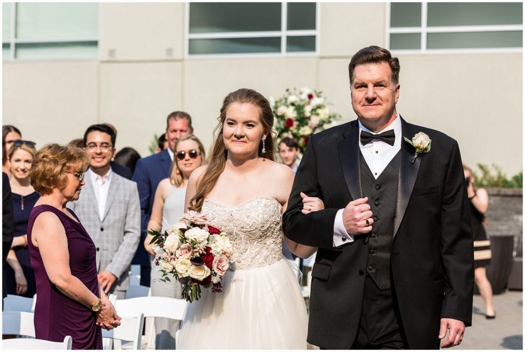 bride and her father walking down the aisle