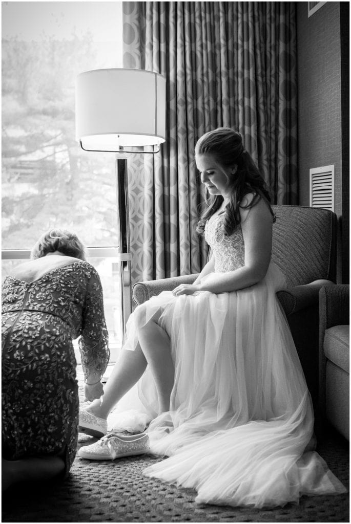 traditional black and white bridal portrait getting ready with help of mom