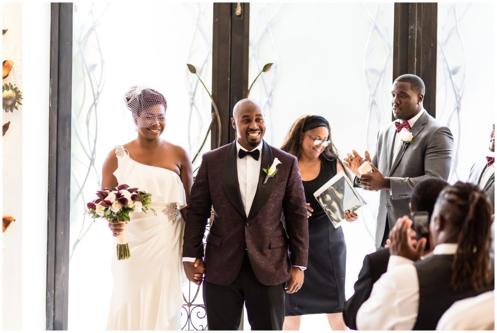 Bride and groom recessing their ceremony as husband and wife