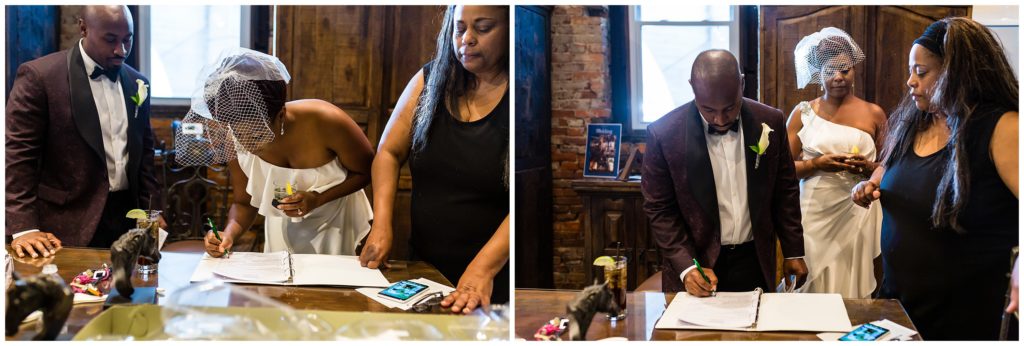 Bride and groom signing wedding papers during intimate ceremony