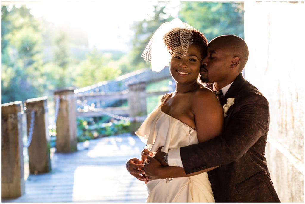 Intimate bride and groom portraits under Manayunk bridge