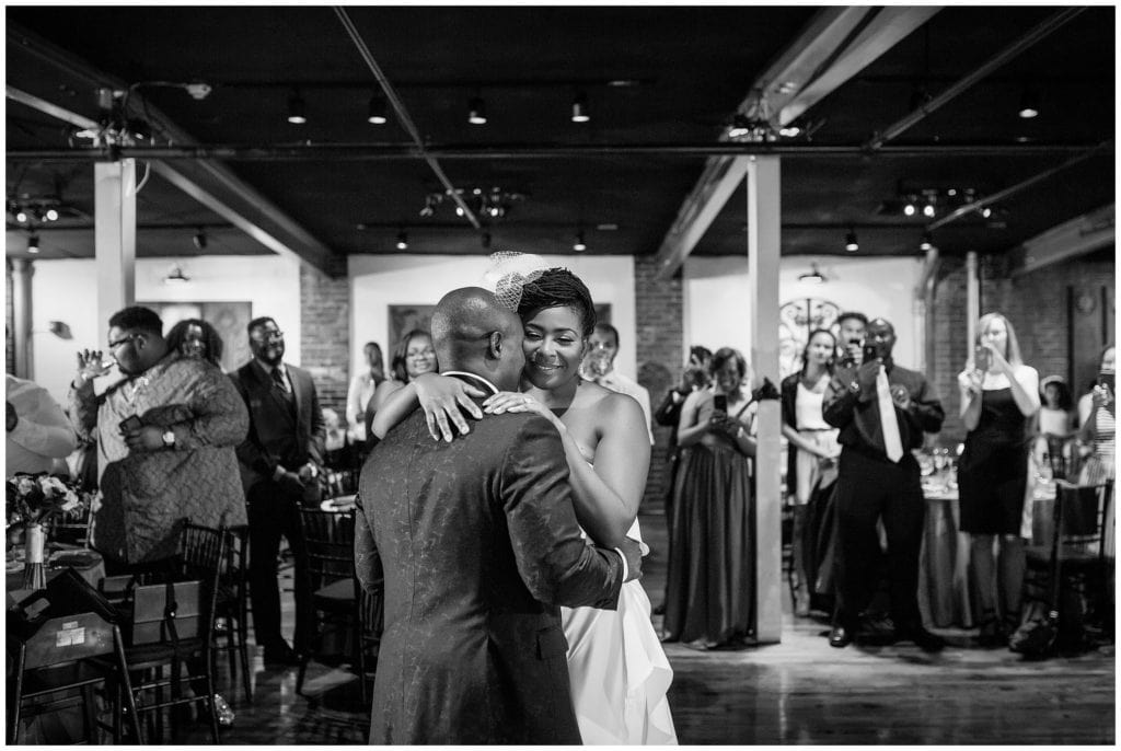 black and white portraits of bride and grooms first dance