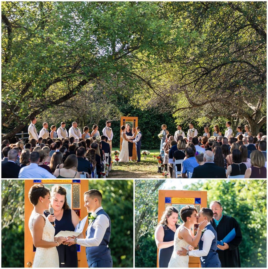 Outdoor wedding ceremony with LGBT brides exchanging vows, rings, and a kiss