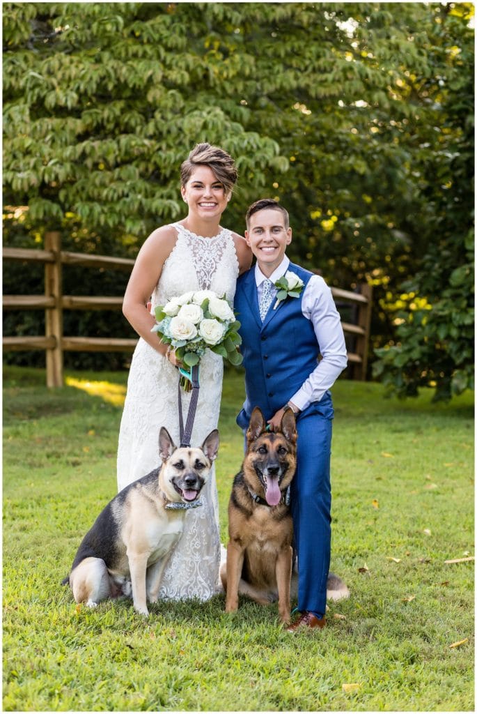 Traditional wedding portrait of brides with their dogs