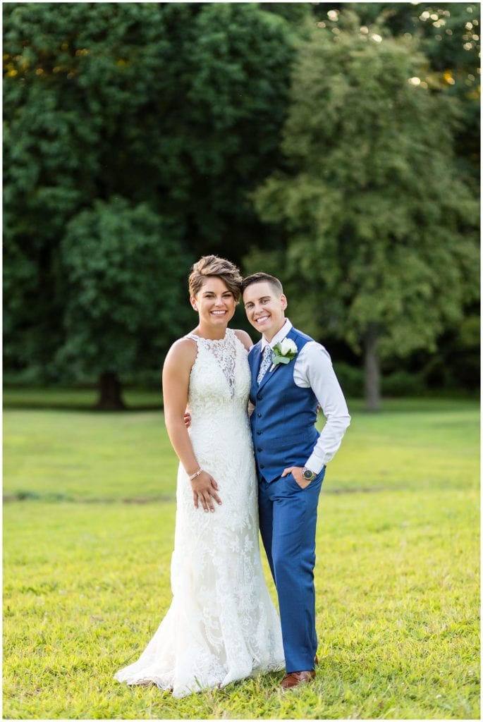 Traditional wedding portrait with LGBT brides, bridal tuxedo and bridal gown