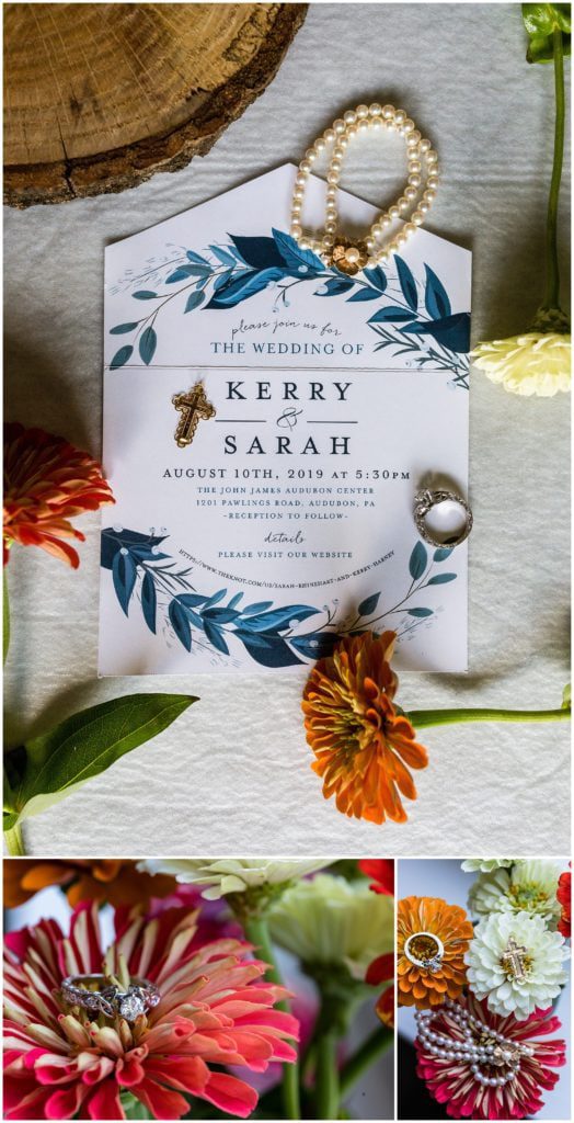 Blue wedding invitation with floral details and bridal jewelry