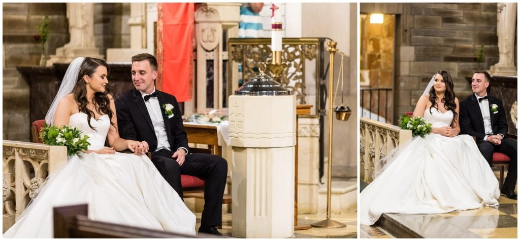Bride and groom share a moment during their Catholic wedding ceremony at Holy Cross Catholic Church