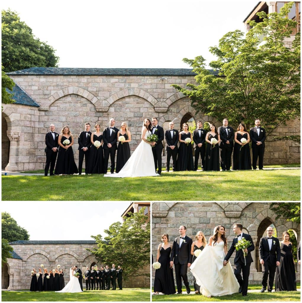 Wedding party portraits with bridesmaids cheering on the kissing bride and groom
