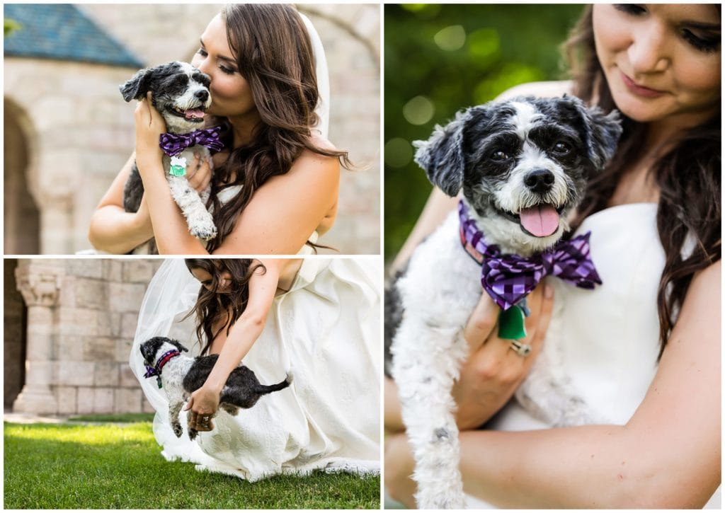 Bride holding and kissing her dog with a bowtie on her wedding day