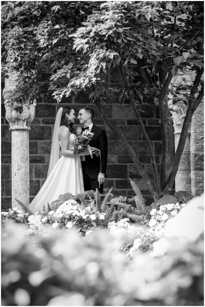 Intimate black and white wedding portrait bride and groom in the gardens
