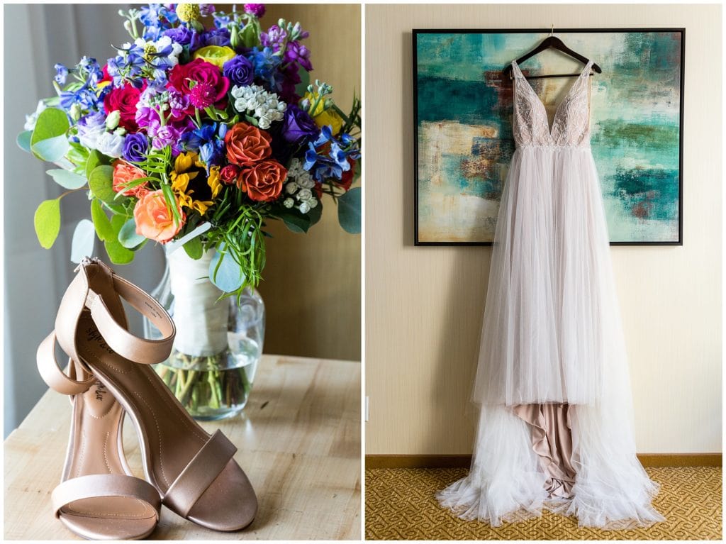 Colorful bridal bouquet, bridal heels, and wedding gown