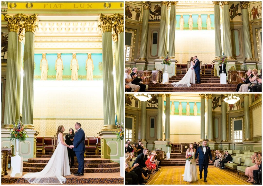 Bride and groom exchanging vows and first kiss during wedding ceremony at One North Broad