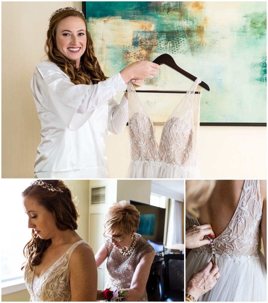 Bride getting into her wedding gown with help of her mother and button detail