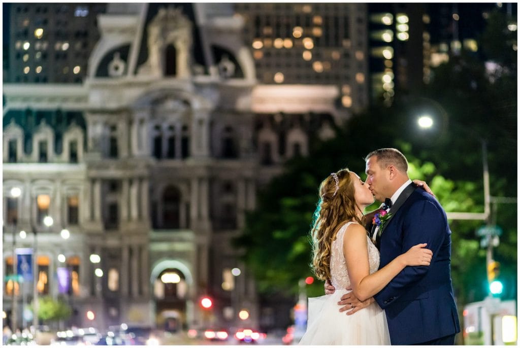 Bride and groom wedding night portrait on Broad Street in front of Philadelphia City Hall