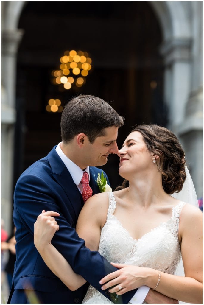 Romantic bride and groom laughing at Philadelphia City Hall