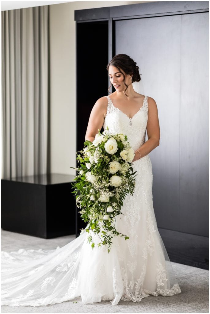 Elegant bridal portrait with unique large bouquet and long greenery