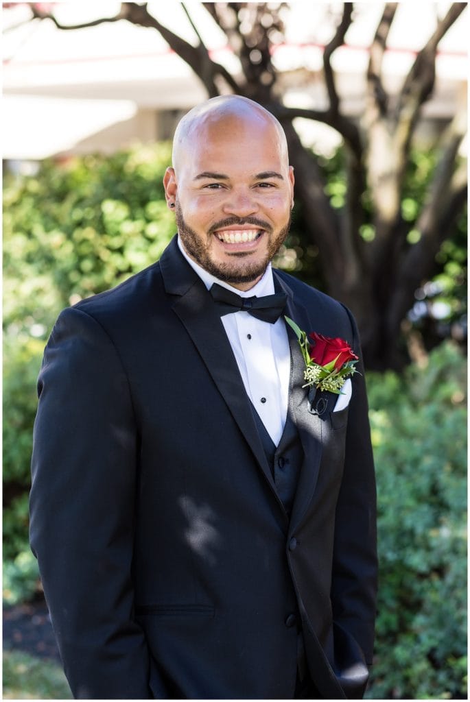 Outdoor groom portrait before first look