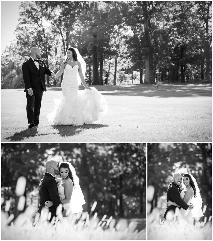 Black and white wedding portraits on golf course with bride and groom walking, kissing on the cheek