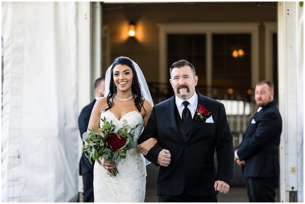Bride walking down aisle with her father