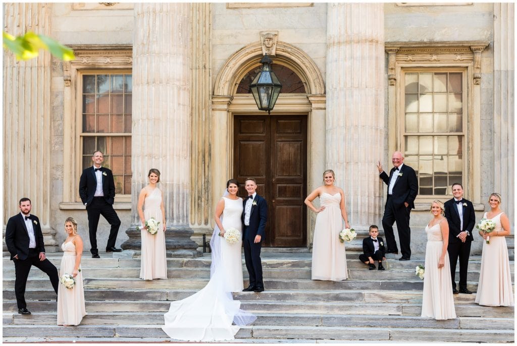 Philadelphia wedding permit - Dramatic wedding party portrait spread out on stairs at Second National Bank